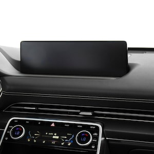 May include: A black dashboard with a large touchscreen display, a digital gauge cluster, and a climate control panel with buttons and knobs.