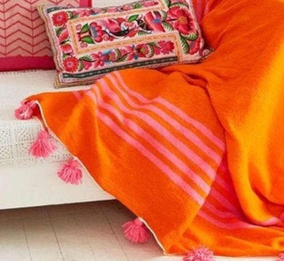 Orange pom 2025 pom throw