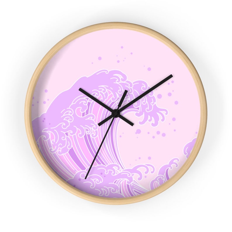 May include: A pink and white wave design wall clock with black hands.