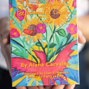 May include: A box of The Codependent Perfectionist's Oracle Cards, illustrated by Evan P. Neidich and edited by Karla La Voie. The box features a colorful illustration of a red bird with yellow, green, and blue flowers.