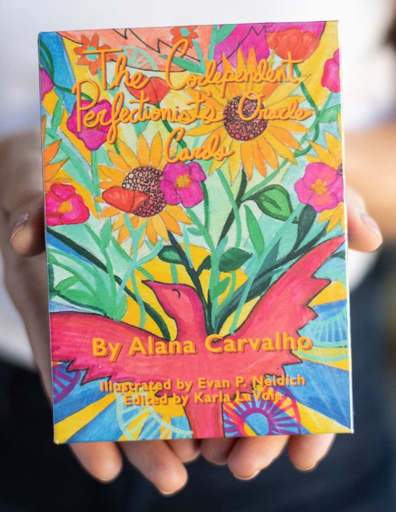 May include: A box of The Codependent Perfectionist's Oracle Cards, illustrated by Evan P. Neidich and edited by Karla La Voie. The box features a colorful illustration of a red bird with yellow, green, and blue flowers.