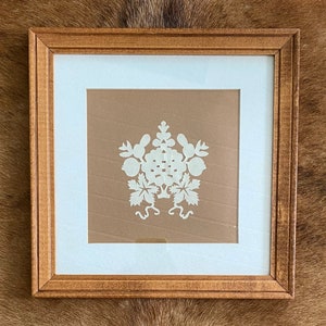 Framed cut paper art