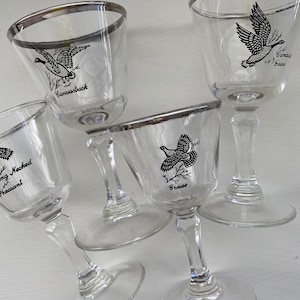 Four Ned Smith game bird cordials