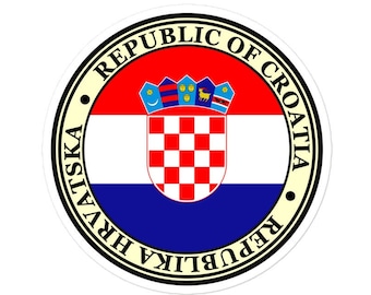 May include: A round sticker featuring the Croatian coat of arms. The design includes a red and white checkered shield, a crown, and the text "REPUBLIKA HRVATSKA" and "REPUBLIC OF CROATIA" in a circular pattern around the emblem.