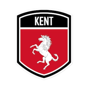 May include: A red and black shield with the word "KENT" in white letters at the top. A white horse is standing on its hind legs in the centre of the shield.