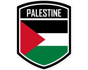 May include: A black and white shield with a red, white, and green Palestinian flag inside. The word "PALESTINE" is written in white letters at the top of the shield.