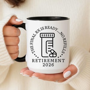 May include: White ceramic mug with a black handle and rim. The mug features a black and white graphic of a prescription bottle and pills, with the text "THE FINAL RX IS READY...NO REFILLS" and "RETIREMENT 2026".