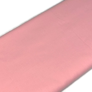 May include: A solid piece of pale pink fabric. The fabric is smooth and has a slight sheen.