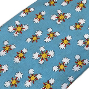 Sunshine and Smiles Fabric by the YARD. Alpha-babies by Henry Glass. Blue Sky, Clouds, Smiling Suns. 100% Cotton for quilts, apparel, décor.