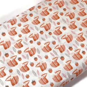 May include: White fabric with a repeating pattern of orange foxes, brown acorns, and gray leaves.