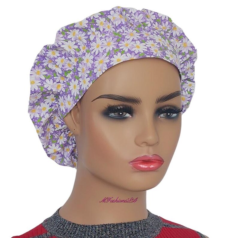a mannequin wearing a head wrap with flowers on it