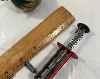 Antique /vintage  tin litho toy top Balou with a launcher made in Germany