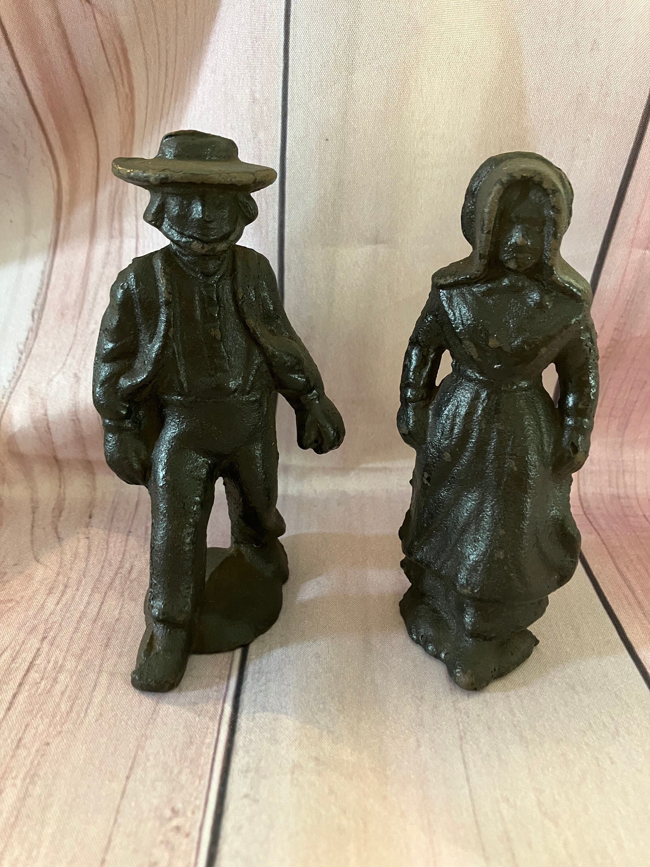 vintage cast iron Amish man and woman figurines