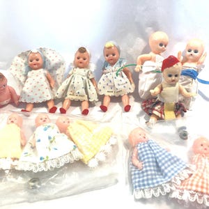 vintage sleepy eye plastic tiny dolls - made in Italy with original dresses