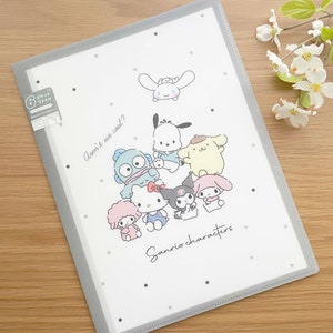 May include: A white plastic folder with a gray border. The folder has a design of various Sanrio characters, including Hello Kitty, My Melody, and Keroppi. The text "Aren't we cool?" and "Sanrio characters" are printed on the folder.