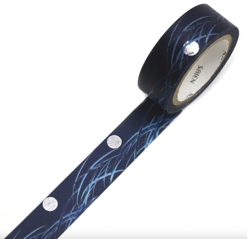 May include: A roll of navy blue washi tape with a silver dot pattern and a blue abstract design. The tape is labeled "SAIEN". This decorative tape is ideal for scrapbooking, journaling, and craft projects.