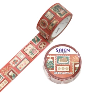 May include: A roll of red masking tape by Saien featuring a repeating pattern of vintage-style postage stamps with Christmas motifs including a tree, gingerbread men, gifts, and stockings. A second roll is wrapped in clear plastic with the brand name.