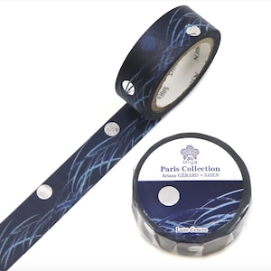 May include: A roll of decorative washi tape with a navy blue background and a pattern of silver circles and light blue lines. The tape is labeled "Paris Collection" with the text "Lune d'encre".