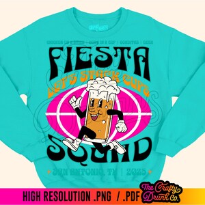May include: A turquoise blue sweatshirt with a graphic design of a cartoon beer mug running with the text "Fiesta Let's Stack Cups Squad" and "San Antonio, TX | 2025".