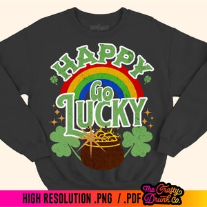 May include: Black sweatshirt with a rainbow, pot of gold, shamrocks, and the text "Happy Go Lucky".