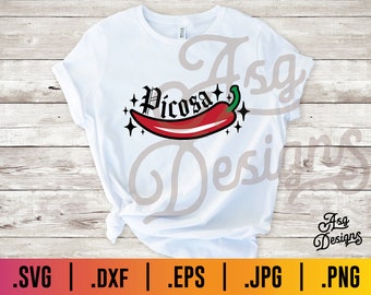 May include: A white t-shirt featuring a red chilli pepper graphic and the word "Picosa" in black lettering. The graphic is surrounded by small stars. The text "Asg Designs" is in the bottom right corner of the image.