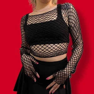 Does anyone have any idea where to find a fishnet shirt and cropped black  shirt like this? : r/findfashion