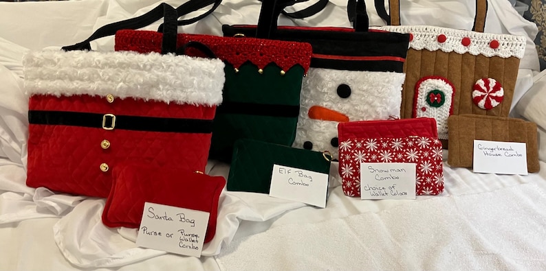 May include: A collection of Christmas-themed bags and wallets. Designs include Santa, an elf, a snowman, and a gingerbread house. The Santa bag is red with a white trim and black belt. The snowman bag has a carrot nose.