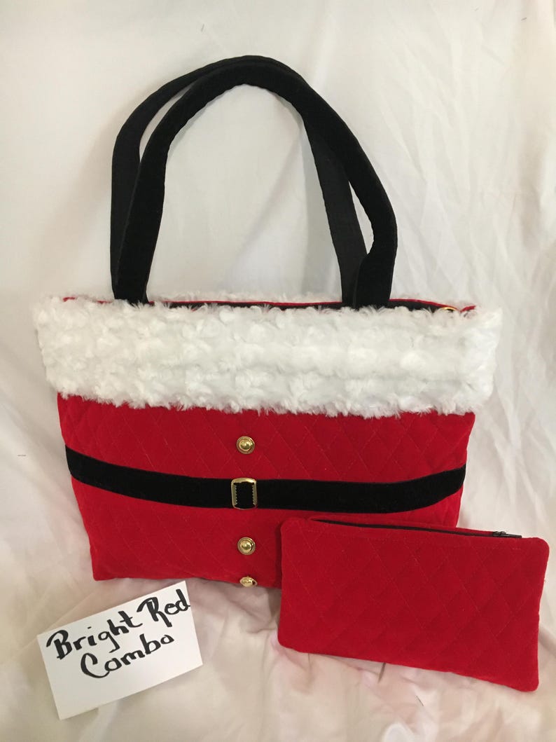 May include: A red quilted tote bag with black handles, a black belt, and gold buttons. The top edge is trimmed with white faux fur. A matching red quilted pouch is included. The text "Bright Red Combo" is on a white card.
