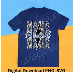 May include: A blue t-shirt with a black lightning bolt and the text "Mama blue devil Mama" in a white and black leopard print.