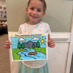 May include: A white sheet of paper featuring a colorful hand-drawn illustration titled The Louisiana Purchase. The drawing depicts a blue river, a brown boat, green pine trees, grey mountains, white clouds, and a yellow sun in a blue sky.