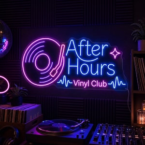 May include: A neon sign displaying the text After Hours Vinyl Club in blue and pink. The sign features a glowing pink vinyl record graphic with a tonearm and a small four-pointed star. The text is illuminated against a dark background.