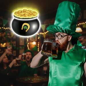 May include: A St. Patrick's Day image showing a man in green attire drinking beer. A glowing pot of gold with a horseshoe and shamrock is in the background, celebrating Irish culture and traditions.