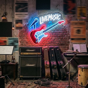 May include: A neon sign with the words "LIVE MUSIC" above a red and blue electric guitar and microphone. The sign is mounted on a brick wall. Musical instruments, including a drum set, amplifier, and keyboard, are in the foreground.