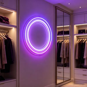 May include: A circular neon wall light featuring two concentric rings that emit a vibrant purple and white glow. The light is mounted on a plain wall between two walk-in closet sections containing hanging garments on hangers and shelves.