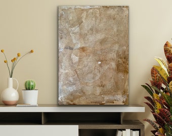 May include: Abstract art painting with a textured, layered, and organic look. The painting is in shades of brown, beige, and white.