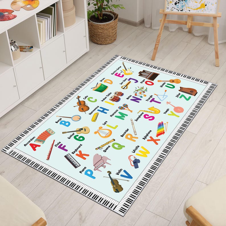 May include: A rectangular rug with a light blue background features musical instruments and the alphabet. The border is designed to look like piano keys. Instruments include a violin, guitar, and piano. The rug is designed for educational purposes.