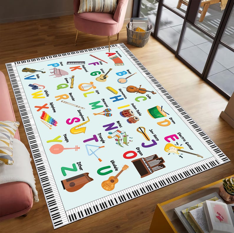 May include: A rectangular area rug with a light blue background features an alphabet with musical instruments. The rug's border is designed to look like piano keys. Instruments include a guitar, violin, drum, and ukulele.
