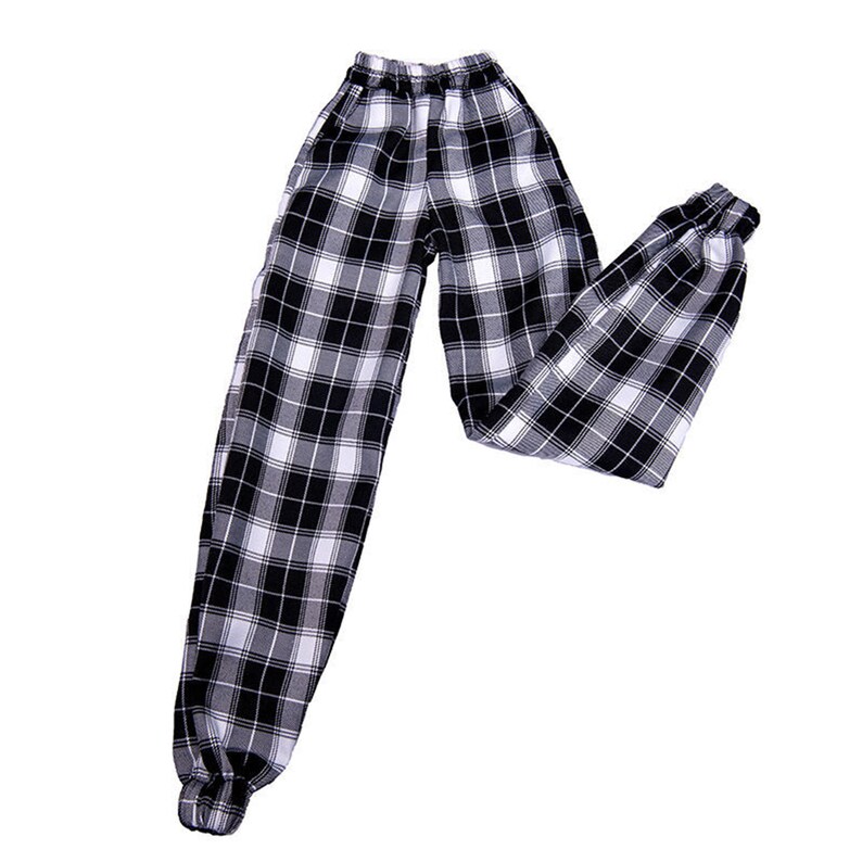 May include: Black and white plaid pants with an elastic waistband and cuffed legs.