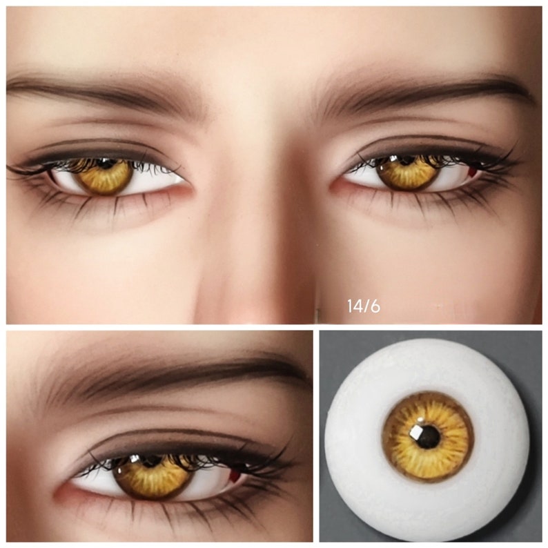 May include: Close-up of a pair of realistic-looking brown and gold colored glass eyes. The eyes are set in a white background.