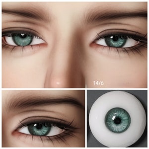 May include: Close-up of a pair of green glass eyes with a white iris. The eyes are set in a doll's head, with brown eyebrows and eyelashes. The eyes are 14/6 mm in size.