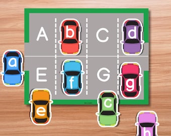 May include: Alphabet matching game featuring a parking lot design with letters A through H. Colorful toy cars in blue, red, purple, orange, green, and pink are paired with corresponding letters. The text "ALPHABET MATCHING" is at the top.