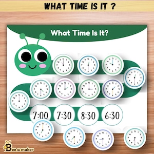 May include: Educational chart titled "What Time Is It?" featuring a green caterpillar design. The chart includes multiple clock faces with different times, along with corresponding digital time displays. The text "What Time Is It?" is displayed at the top.