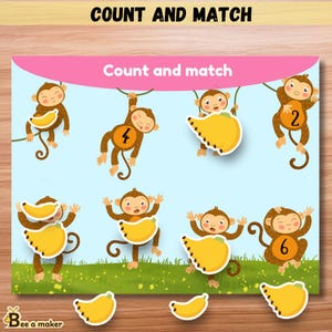 May include: A colorful educational game with the text "Count and Match". The game features cartoon monkeys holding bananas and numbers. The background is light blue with green grass and a pink banner.