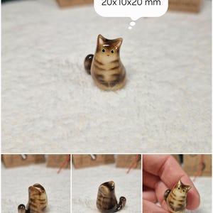 Adorable Brown tabby cat figurine with green eyes. If you would like to change the eye color of the Brown tabby cat figurine to yellow, please select the "Eyes/Nose Changes" option.
