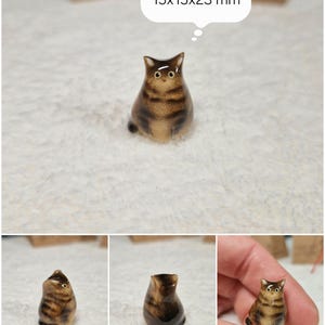 Fat Brown tabby cat figurine with yellow eyes. If you would like to change the eye color of the Brown tabby cat figurine to green, please select the "Eyes/Nose Changes" option.
