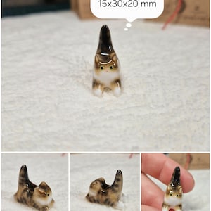 Playful Brown tabby cat figurine with yellow eyes. If you would like to change the eye color of the Brown with White tabby cat figurine to green, please select the "Eyes/Nose Changes" option.