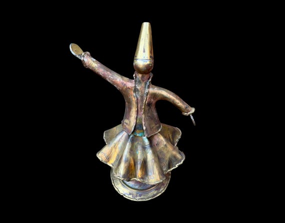 Raw-forged brass Whirling Dervish that actually spins — a meditative, culturally rich kinetic sculpture you won't find anywhere else.