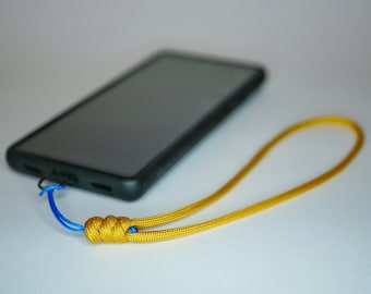 Correa de muñeca para teléfono de paracord con lengüeta de sujeción / Correa de muñeca para teléfono / Color personalizado