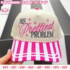 May include: A cream-coloured baseball cap with a pink and white striped brim. The front features embroidered text that reads HIS Prettiest PROBLEM in pink and dark grey, accented with small pink star shapes. Text at the top reads FLAT VERSION - 3 SIZES : 4" 5" 6".
