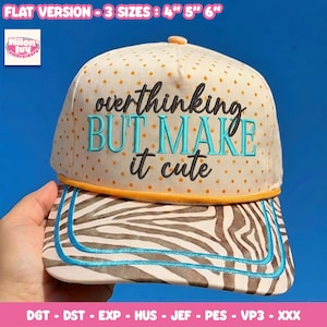 May include: A cream-colored baseball cap with orange polka dots and a zebra-striped brim. The front features the embroidered text "overthinking BUT MAKE it cute" in black and teal. An orange cord trim separates the crown from the brim.
